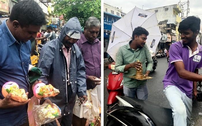 un homme négocie des statuettes de Ganesh, un autre l'emporte en scooter